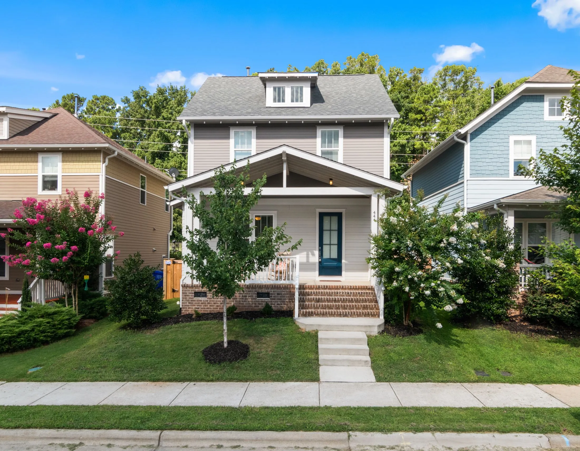 Two-story suburban home with painted siding and trim